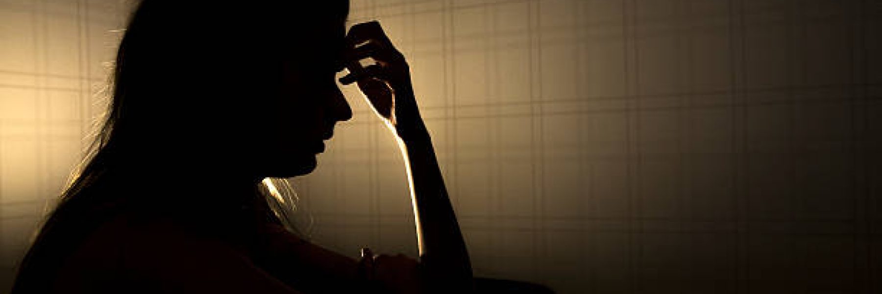 sad woman profile in dark head is put down, stressed young girl touching head and thinkingsad woman profile in dark head is put down, stressed young girl touching head and thinking