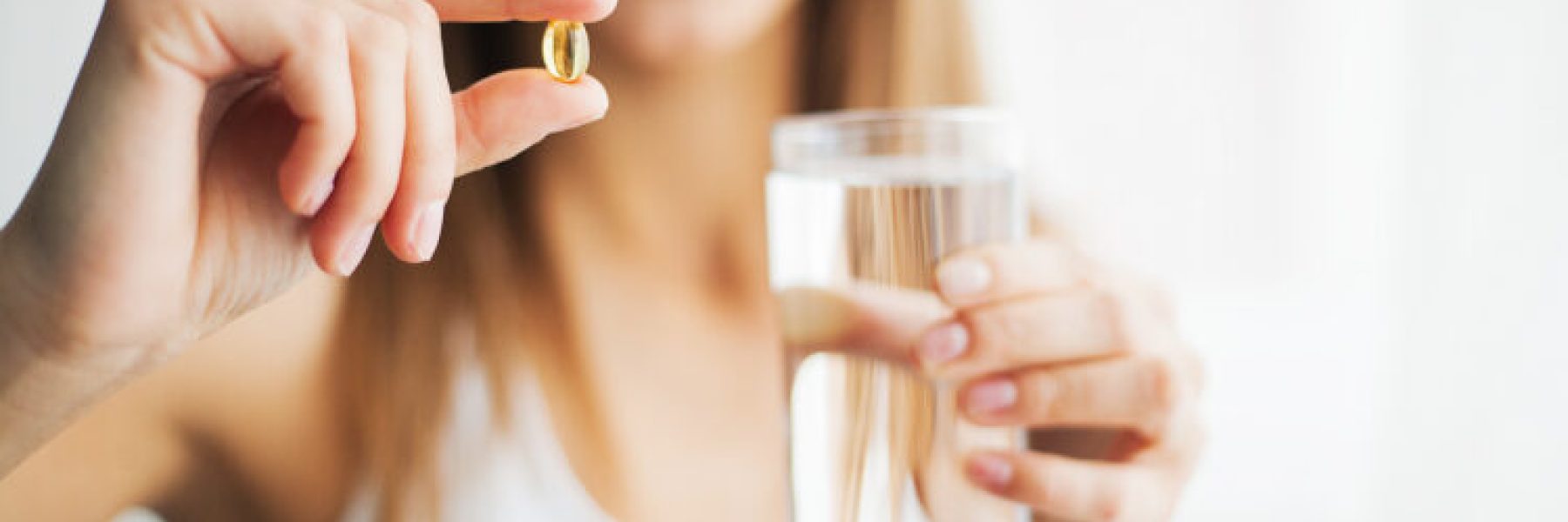 Vitamins And Supplements. Woman Taking Tablet, Medicine.
